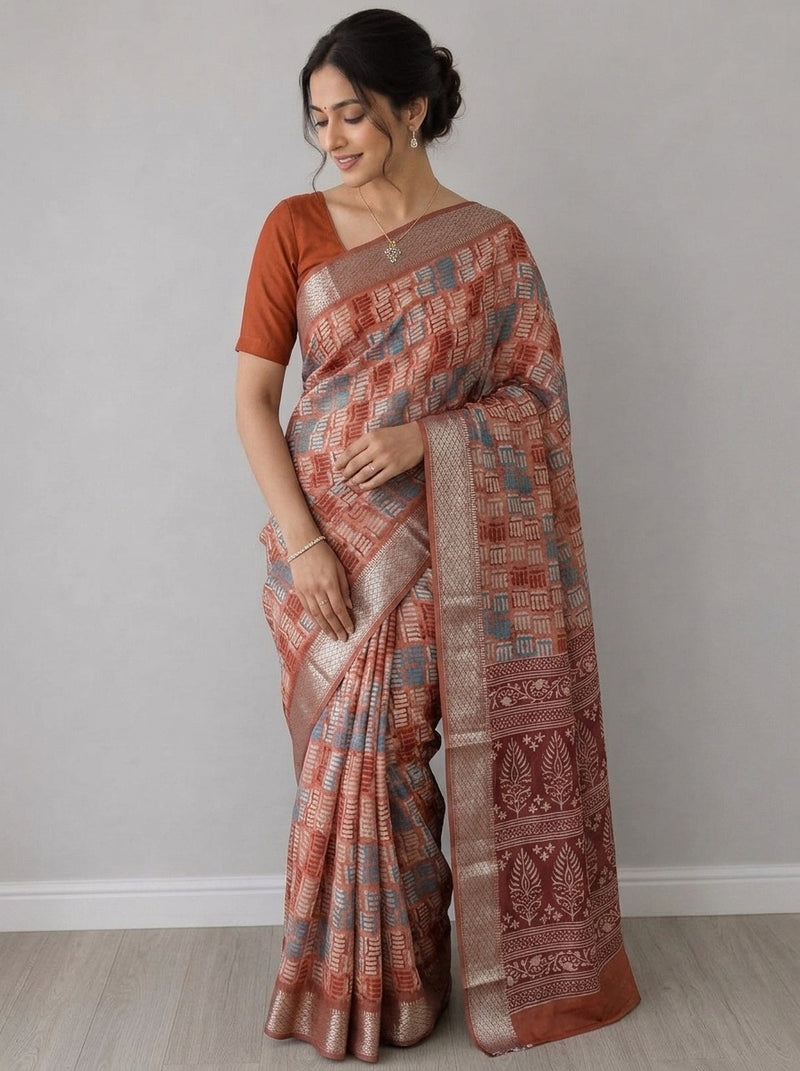 Rust printed saree with blouse piece